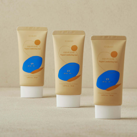 Three tubes of 12GRABS Vegan Comforting Sun SPF50+ PA++++, a vegan mineral sunscreen SPF50 for sensitive skin.
