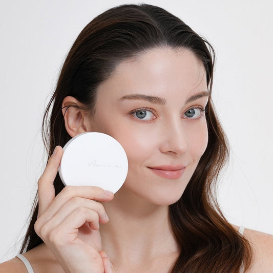 Model applying Amica Recovery Sun Cushion SPF35 PA++ on face
