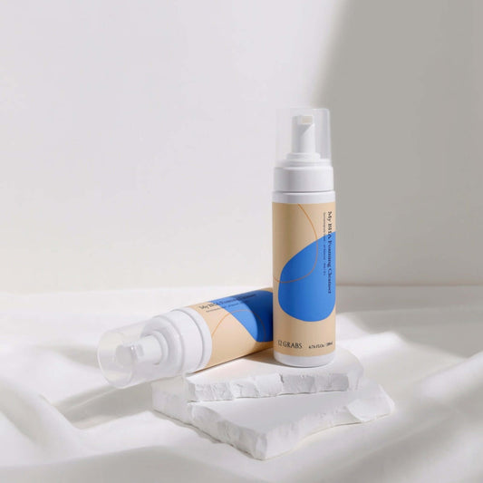 BHA foaming cleanser for acne-prone skin in elegant packaging on a white background.