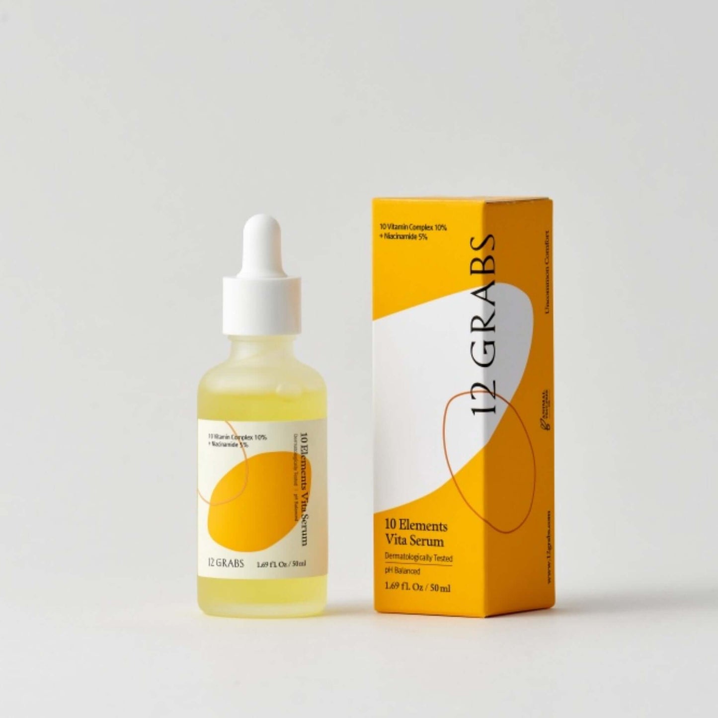 12GRABS 10 Elements Vita Serum, a Korean vitamin brightening serum in a dropper bottle next to its box packaging.