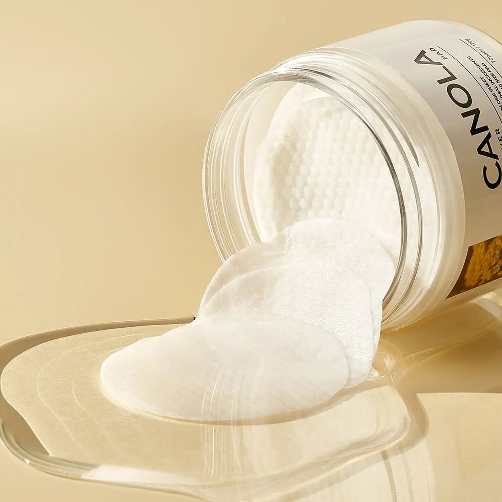 GRAYMELIN Canola Remover Pad jar with pads spilling out, showcasing canola cleansing pads for gentle makeup removal.